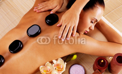 Adult_woman_having_hot_stone_massage_in_spa_salon.jpg